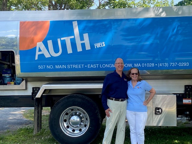 Ed & Joan standing in front of Auth Fuels oil truck