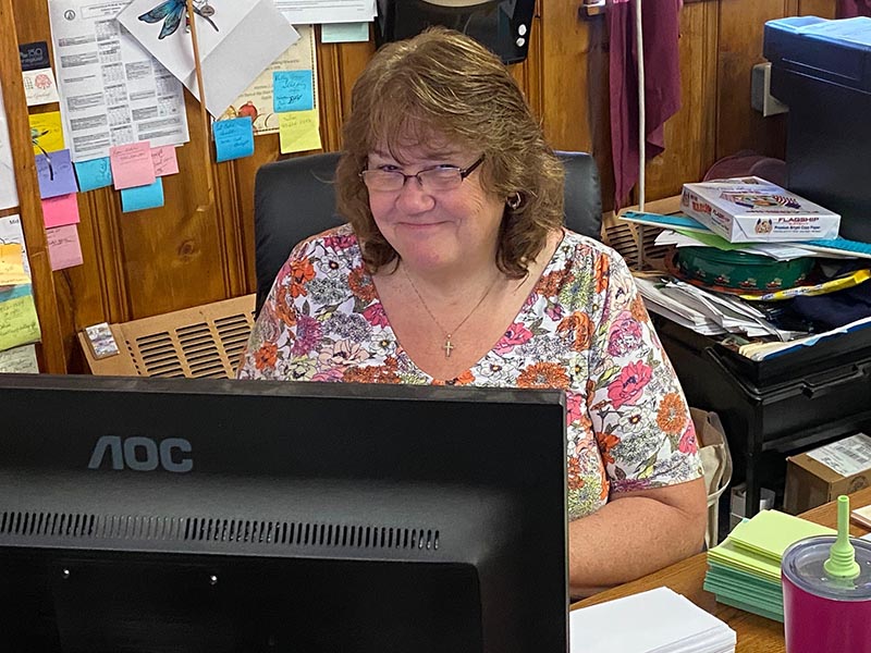 Sue sitting at the Auth Fuels office